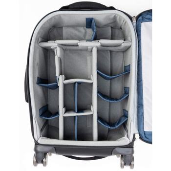 Open camera equipment roller case with gray fabric dividers and compartments for lenses and accessories.
