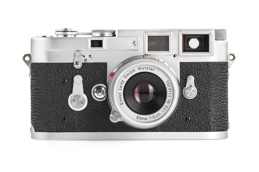 Top view of a Leica M rangefinder camera with chrome and black leather body and Elmar lens.