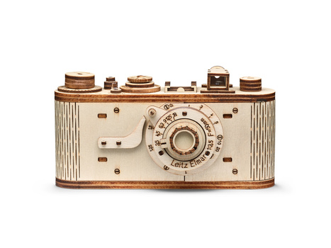 Illustration of a vintage film camera with wooden body and cream-colored faceplate featuring manual controls.