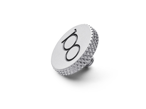 White circular knurled knob with two curved lines symbol on top, photographed at an angle against a white background.