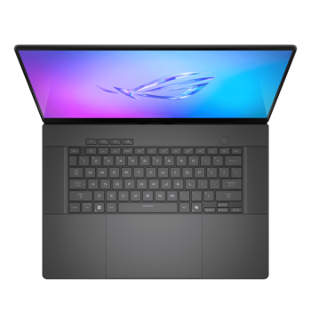Overhead view of a laptop with colorful gradient display showing blue and purple tones.