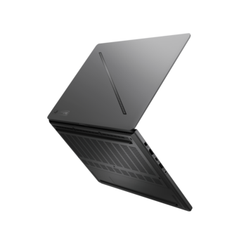 Laptop computer photographed from an angled perspective with screen open and keyboard visible.