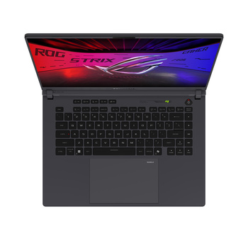 Top-down view of a dark gray laptop with colorful red and blue gradient display wallpaper.