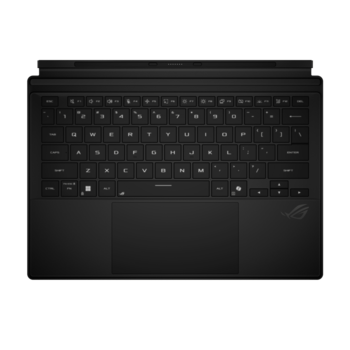 Top-down view of a black laptop keyboard and trackpad against a dark surface.