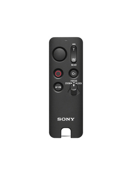 Sony remote control with dial, buttons, and red power indicator on black background.