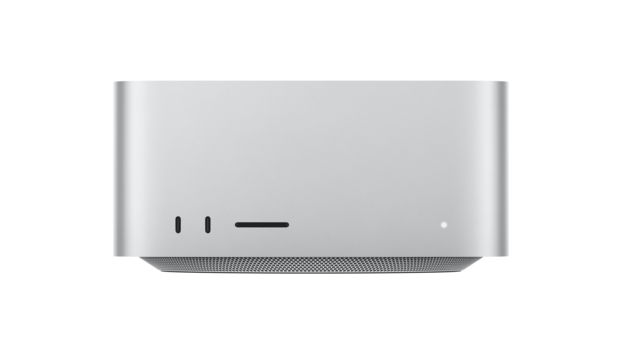 Silver desktop computer with minimal indicator lights and a mesh speaker grille at the base.