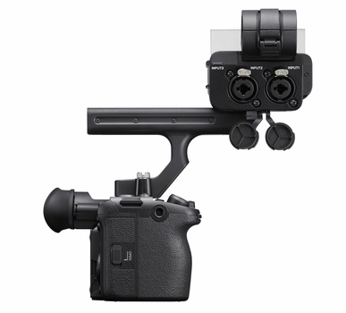 Professional cinema camera rig with dual-lens setup and top-mounted audio recorder.