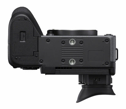 Black mirrorless camera shown from rear three-quarter view with articulating screen extended.