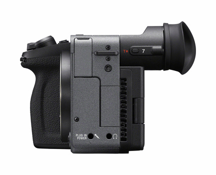 Professional compact cinema camera with pistol grip, viewfinder, and control interface displayed against white background.