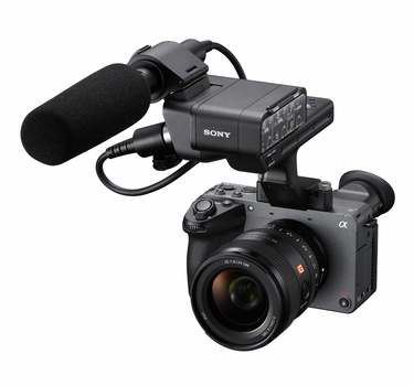 Sony mirrorless camera with mounted microphone and audio recorder on top.