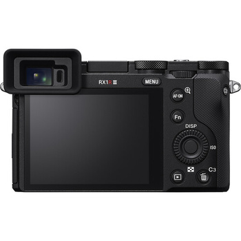 Rear view of a compact mirrorless camera displaying LCD screen and control buttons.