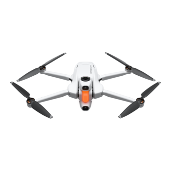Compact drone with white body, orange accents, and four black propellers in symmetrical folded configuration.