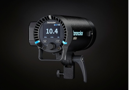 Broncolor Siros monolight with digital display showing 10.4 power setting and control buttons.