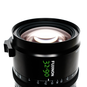 Fujinon wide-angle lens with green text marking and aperture ring detail visible against white background.