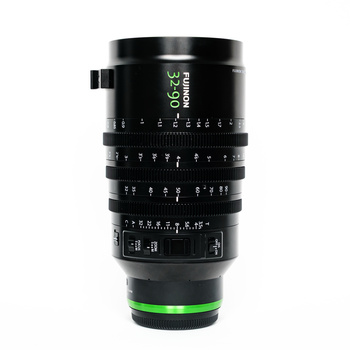 Black telephoto lens with green accent ring and manual focus scale markings visible.