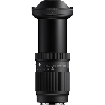 Black telephoto zoom lens with extended barrel and ribbed focus ring against white background.