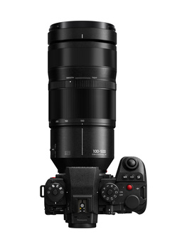Mirrorless camera with large telephoto lens mounted on top, shown from front view against white background.