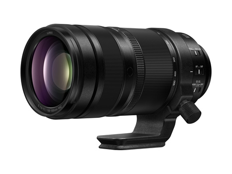 Black telephoto lens with purple-tinted front element and focus ring, mounted on a tripod collar.