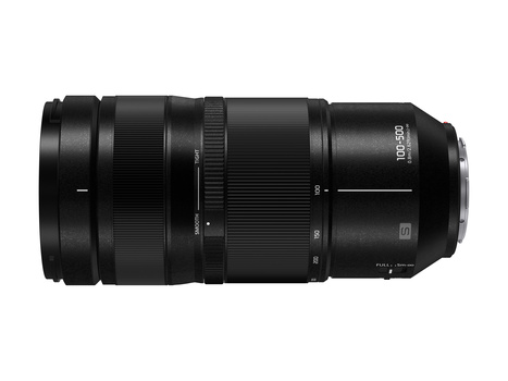 Black telephoto zoom lens with ribbed focus ring and electronic contacts on white background.
