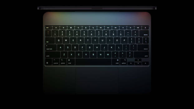 Screenshot of a laptop keyboard with backlit keys displayed against a dark background.