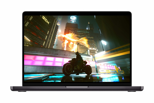 Screenshot of a laptop displaying an action video game scene with neon-lit urban environment and explosion effects.