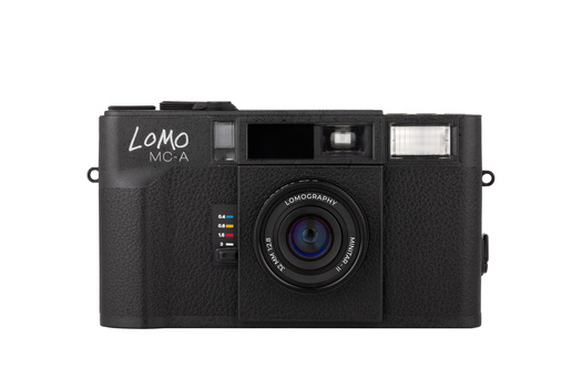Lomo MC-A compact film camera with black textured body and fixed lens.