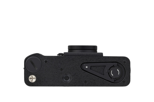 Top view of a black rangefinder camera body showing mechanical controls and viewfinder.