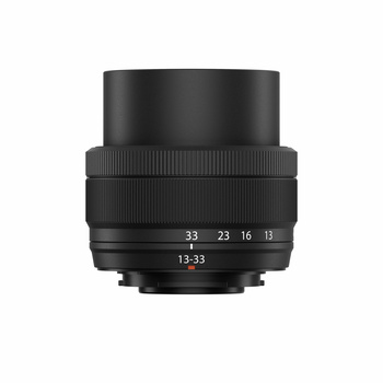 Black prime lens with focal length markings and focus ring displayed against white background.