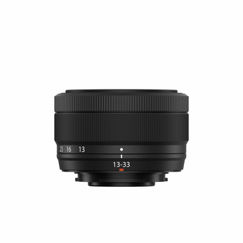 Black camera lens with 13-33mm focal length markings and focus ring against white background.
