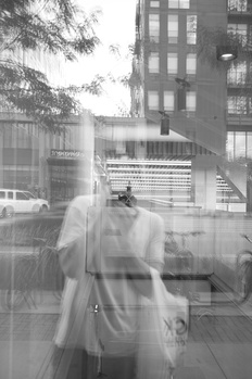 Double exposure portrait of a woman's face overlaid with urban architecture and street scene.