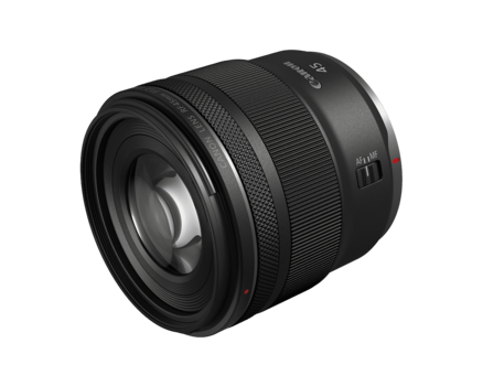 Black telephoto lens with textured grip rings and control elements visible on the barrel.