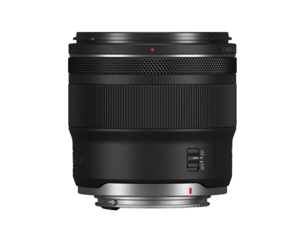 Black camera lens with textured grip ring and control buttons on white background.