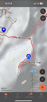 Screenshot of a hiking trail map application showing a red route path with blue location markers and elevation data.