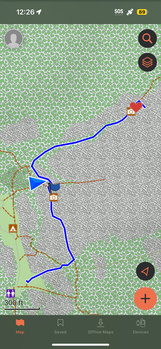 Screenshot of a mapping application showing a blue route traced across a landscape with terrain markers and navigation interface elements.