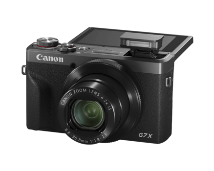 Canon PowerShot G7 X Mark II compact camera with flip-up LCD screen and pop-up flash.