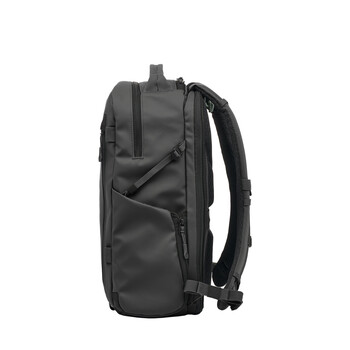 Black camera backpack shown from the side, displaying padded straps and multiple compartments.