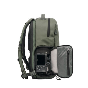 Olive-green camera backpack with detachable weatherproof side compartment containing camera gear.