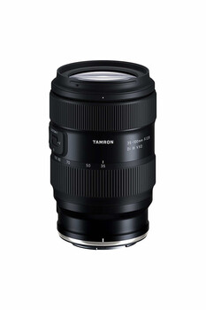 Tamron 70-180mm telephoto zoom lens with black barrel and focus ring against white background.