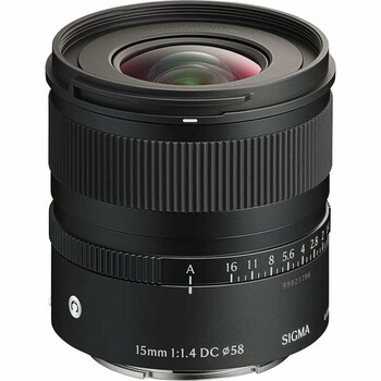 Sigma 15mm f/1.4 DC HSM Art lens with focus ring and distance scale visible against white background.