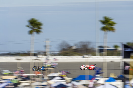 The No. 23 Aston Martin being chased by the No. 6 Porsche Penske Motorsport car at Daytona