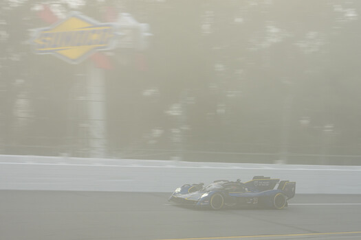 The Heart of Racing Aston Martin Valkyrie in Speedway turn three during the last of the thick fog. 