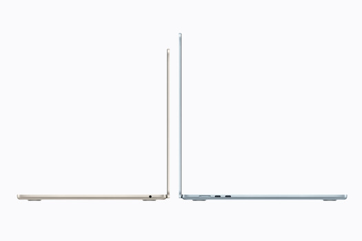Two laptops displayed side-by-side in open position, showing silver and blue aluminum chassis.