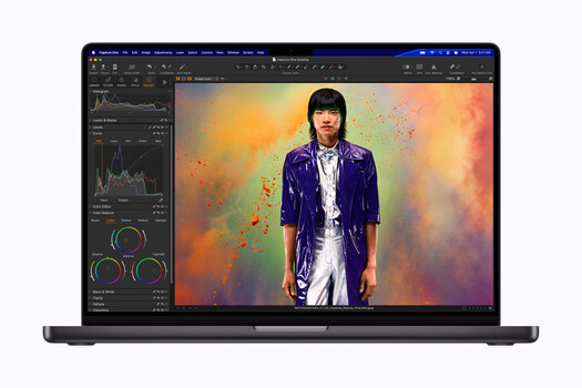 Screenshot of photo editing software displaying portrait with colorful abstract background effects.