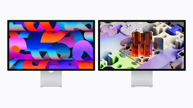 Two modern displays side by side showing abstract 3D rendered graphics with vibrant colors and geometric shapes.