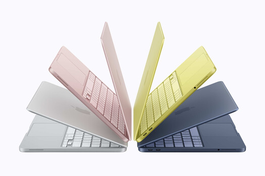 Illustration of five colorful laptops arranged in an overlapping fan pattern against a white background.