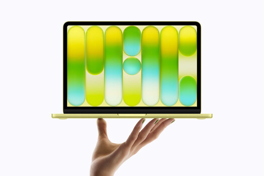 Illustration of a laptop displaying colorful gradient spheres and vertical bars in yellow, green, and blue tones.