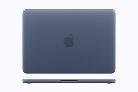 MacBook Pro closed with dark blue case against white background.