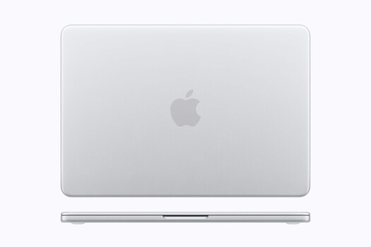 Silver laptop computer photographed from above against a neutral background.