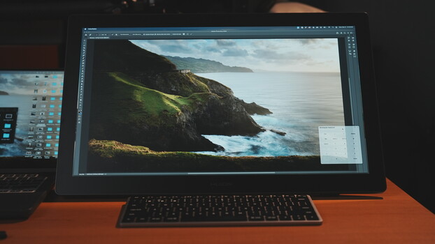Screenshot of image editing software displaying a coastal landscape photograph with green cliffs and ocean.
