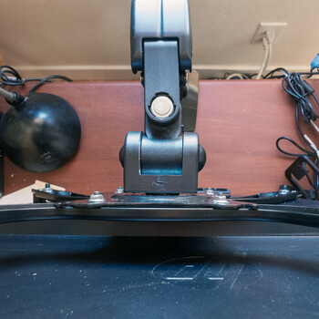 A bird's eye view of the  Huanuo HNMUA4 Universal VESA Mount Adapter Kit and the Flowlift Arm.
